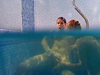 Seductive Brunette Lesbians Tickle Their Snatches Under Water In Pool